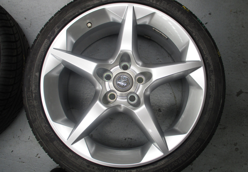 Five-spoke silver wheel — after restoration