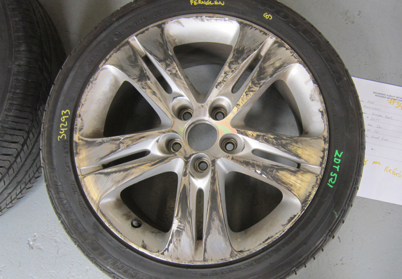 Insurance repair, tyre fitted — before restoration